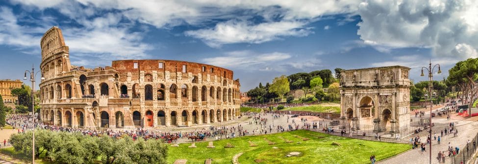 Colosseum and the Arch of Constantine with a view of Rome at sunset